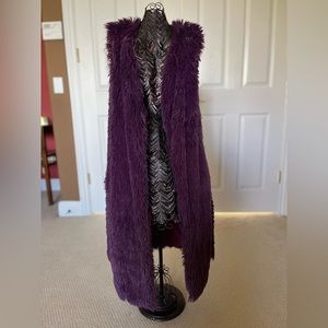 Long faux fur vest.
